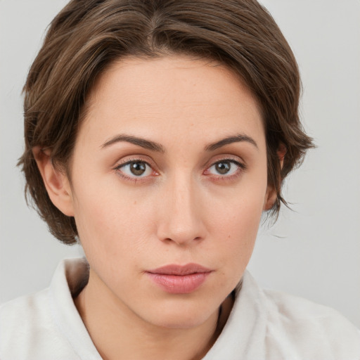 Neutral white young-adult female with medium  brown hair and green eyes