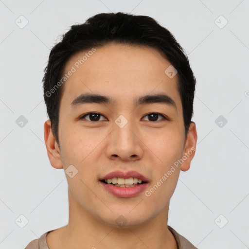 Joyful asian young-adult male with short  black hair and brown eyes