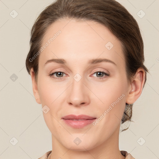 Joyful white young-adult female with medium  brown hair and green eyes