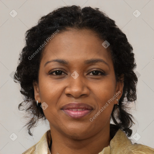 Joyful black adult female with medium  brown hair and brown eyes