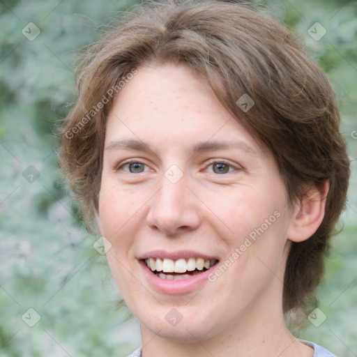 Joyful white young-adult female with medium  brown hair and green eyes