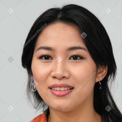 Joyful asian young-adult female with medium  black hair and brown eyes