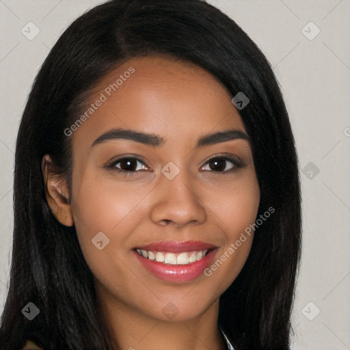 Joyful latino young-adult female with long  brown hair and brown eyes