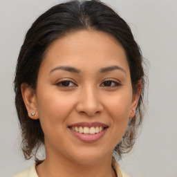 Joyful asian young-adult female with medium  brown hair and brown eyes