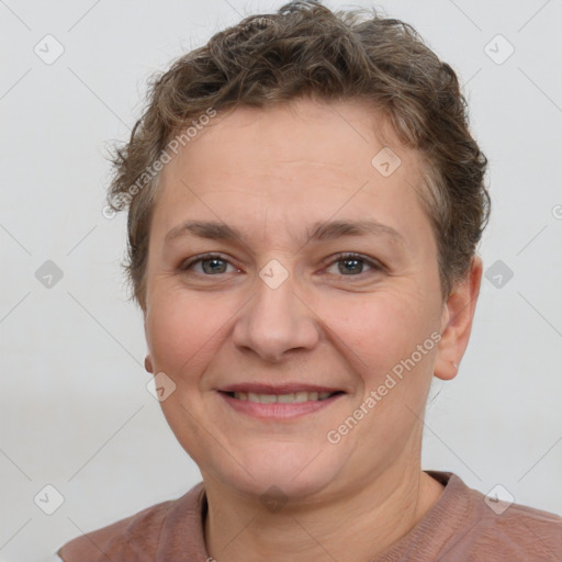 Joyful white adult female with short  brown hair and brown eyes