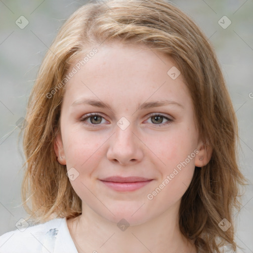 Joyful white young-adult female with medium  brown hair and blue eyes