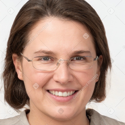 Joyful white adult female with medium  brown hair and grey eyes