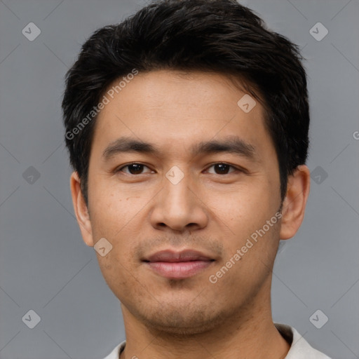 Joyful asian young-adult male with short  black hair and brown eyes