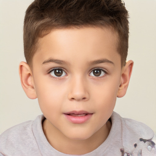 Joyful white child male with short  brown hair and brown eyes