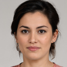 Joyful white young-adult female with medium  brown hair and brown eyes