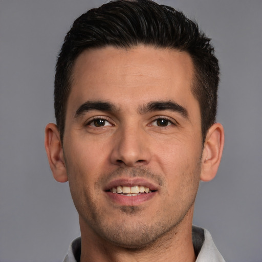Joyful white young-adult male with short  brown hair and brown eyes