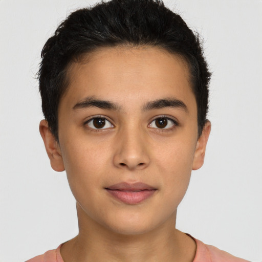 Joyful latino young-adult male with short  brown hair and brown eyes