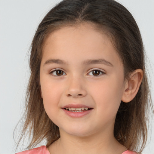 Joyful white child female with medium  brown hair and brown eyes