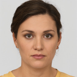 Neutral white young-adult female with short  brown hair and brown eyes