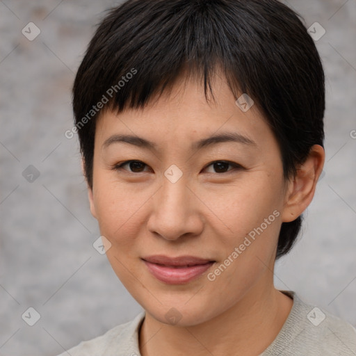 Joyful asian young-adult female with short  brown hair and brown eyes