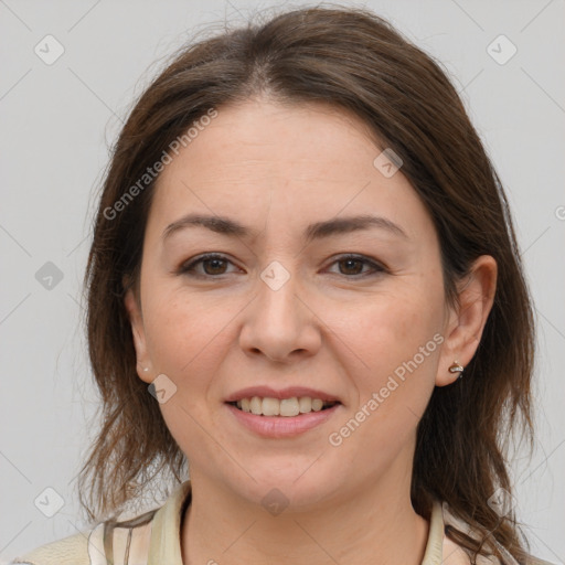 Joyful white young-adult female with medium  brown hair and grey eyes