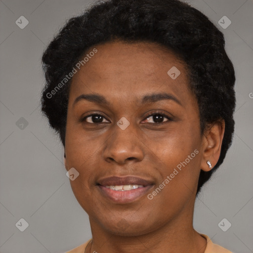 Joyful black young-adult female with short  black hair and brown eyes