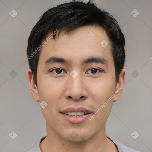 Joyful asian young-adult male with short  black hair and brown eyes