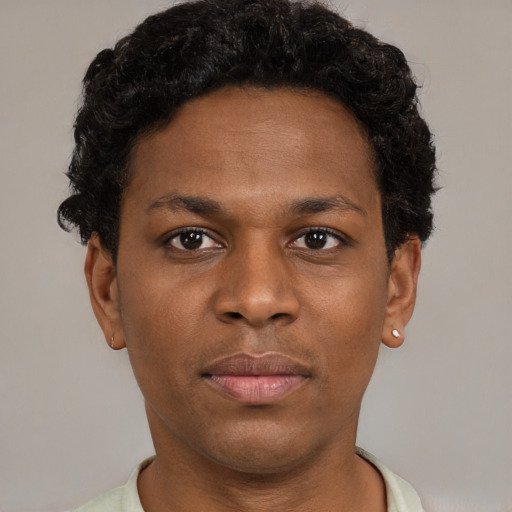 Neutral black young-adult male with short  brown hair and brown eyes