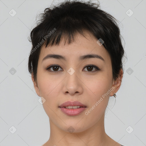 Joyful asian young-adult female with short  brown hair and brown eyes