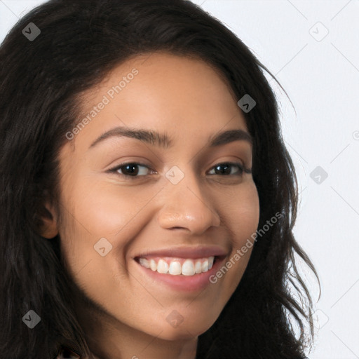 Joyful latino young-adult female with long  brown hair and brown eyes