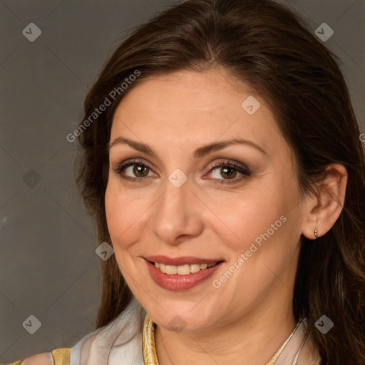 Joyful white adult female with long  brown hair and brown eyes