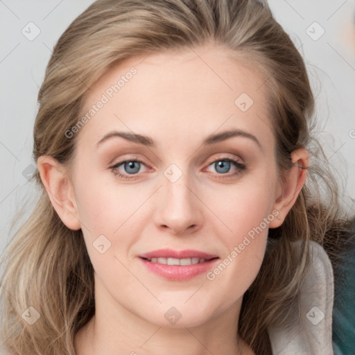 Joyful white young-adult female with medium  brown hair and blue eyes