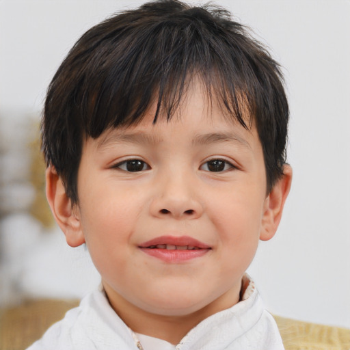 Joyful asian child male with short  brown hair and brown eyes