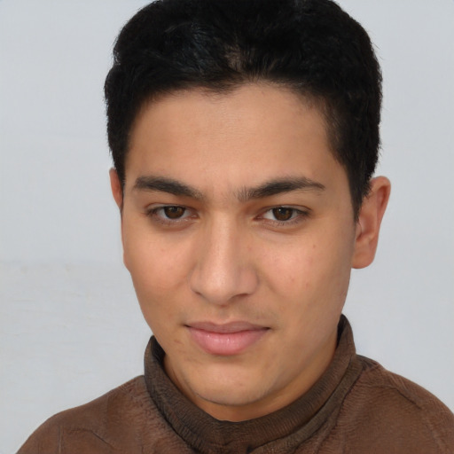 Joyful latino young-adult male with short  brown hair and brown eyes