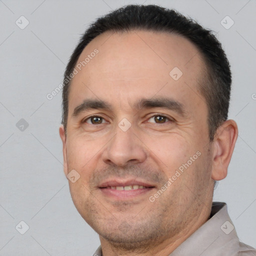 Joyful white adult male with short  brown hair and brown eyes