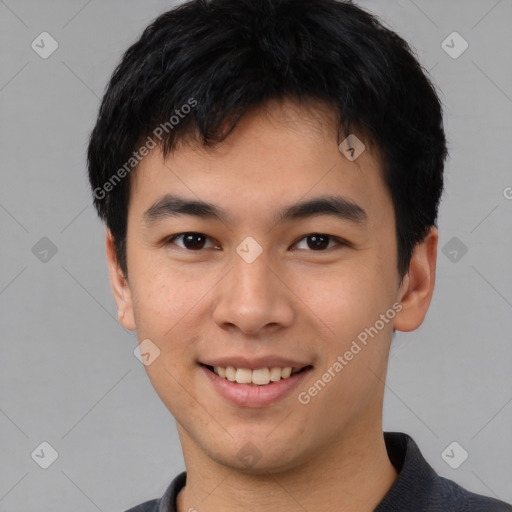 Joyful asian young-adult male with short  black hair and brown eyes