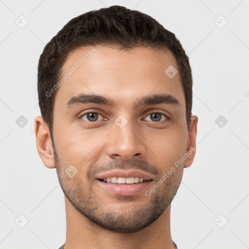 Joyful white young-adult male with short  brown hair and brown eyes