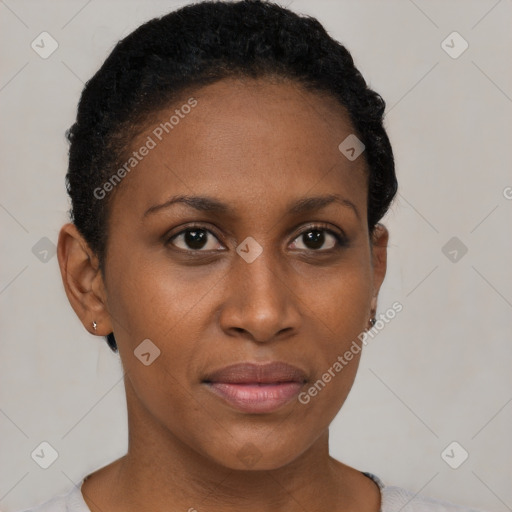 Joyful black young-adult female with short  brown hair and brown eyes