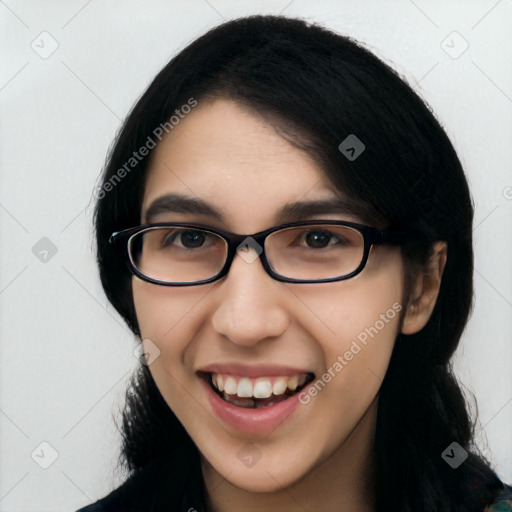 Joyful white young-adult female with long  black hair and brown eyes