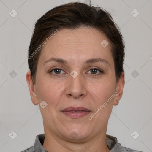 Joyful white adult female with short  brown hair and brown eyes