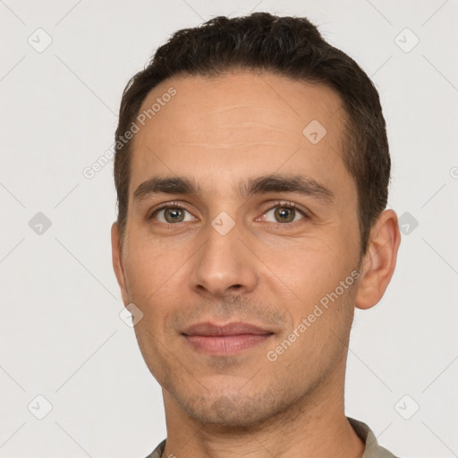 Joyful white young-adult male with short  brown hair and brown eyes