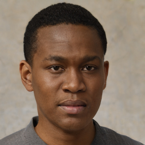 Neutral black young-adult male with short  brown hair and brown eyes