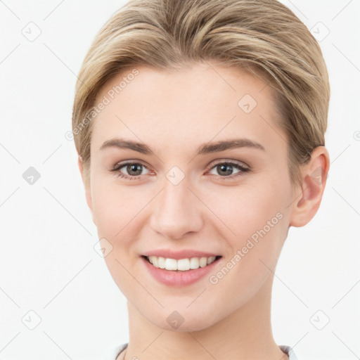 Joyful white young-adult female with short  brown hair and grey eyes