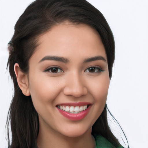 Joyful white young-adult female with long  brown hair and brown eyes