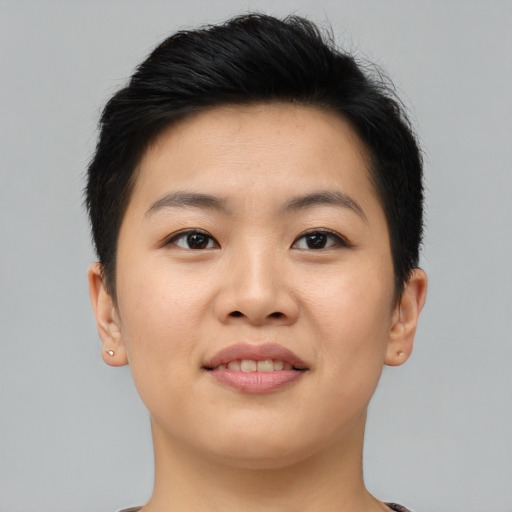 Joyful asian young-adult female with short  brown hair and brown eyes