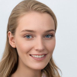 Joyful white young-adult female with long  brown hair and blue eyes