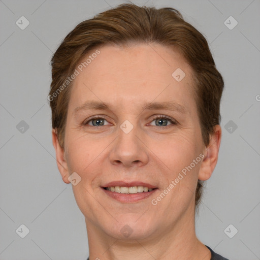 Joyful white adult female with short  brown hair and grey eyes