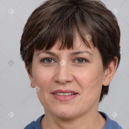 Joyful white adult female with short  brown hair and brown eyes