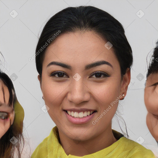 Joyful asian young-adult female with medium  brown hair and brown eyes