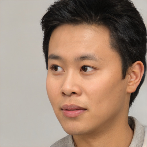 Neutral asian young-adult male with short  black hair and brown eyes