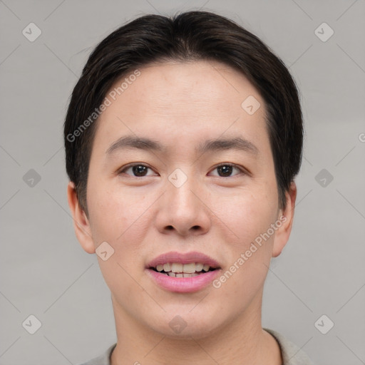 Joyful asian young-adult male with short  brown hair and brown eyes