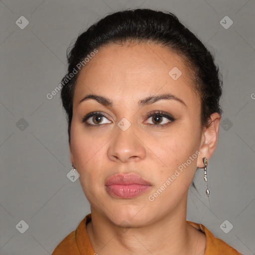 Joyful latino young-adult female with short  brown hair and brown eyes