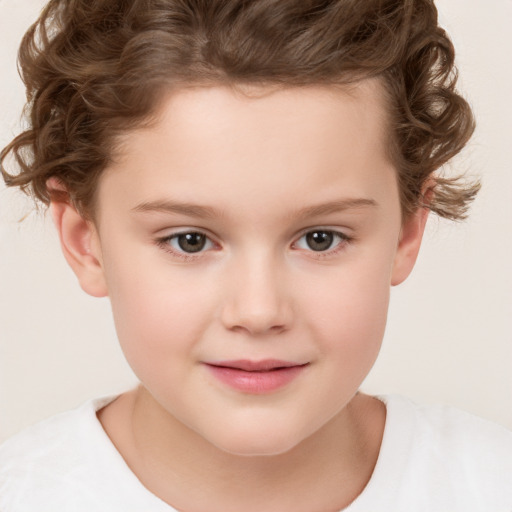 Joyful white child female with short  brown hair and brown eyes