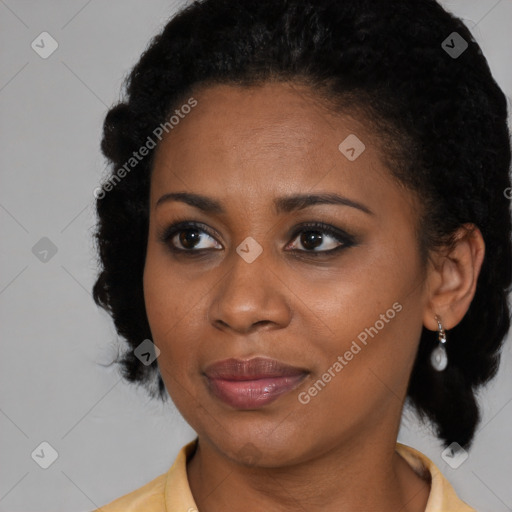 Joyful black young-adult female with medium  black hair and brown eyes