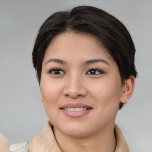 Joyful white young-adult female with medium  brown hair and brown eyes